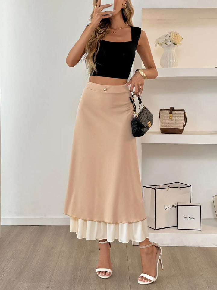 Layered A-line midi skirt with contrast ruffle hem