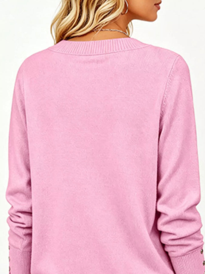 V-neck long sleeve sweater with button cuffs and side slits