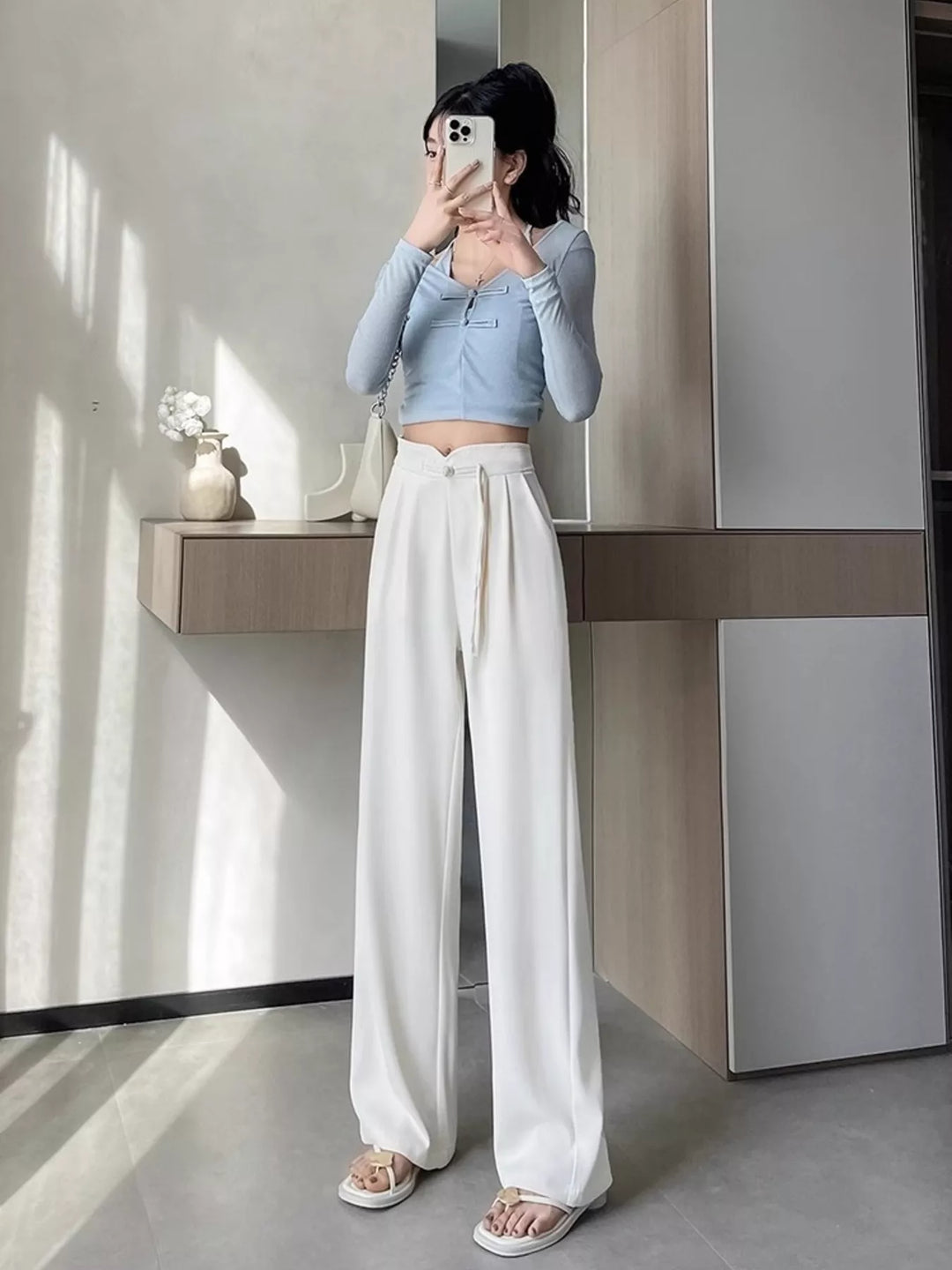 High-rise wide-leg pants with pleated front and tie waist