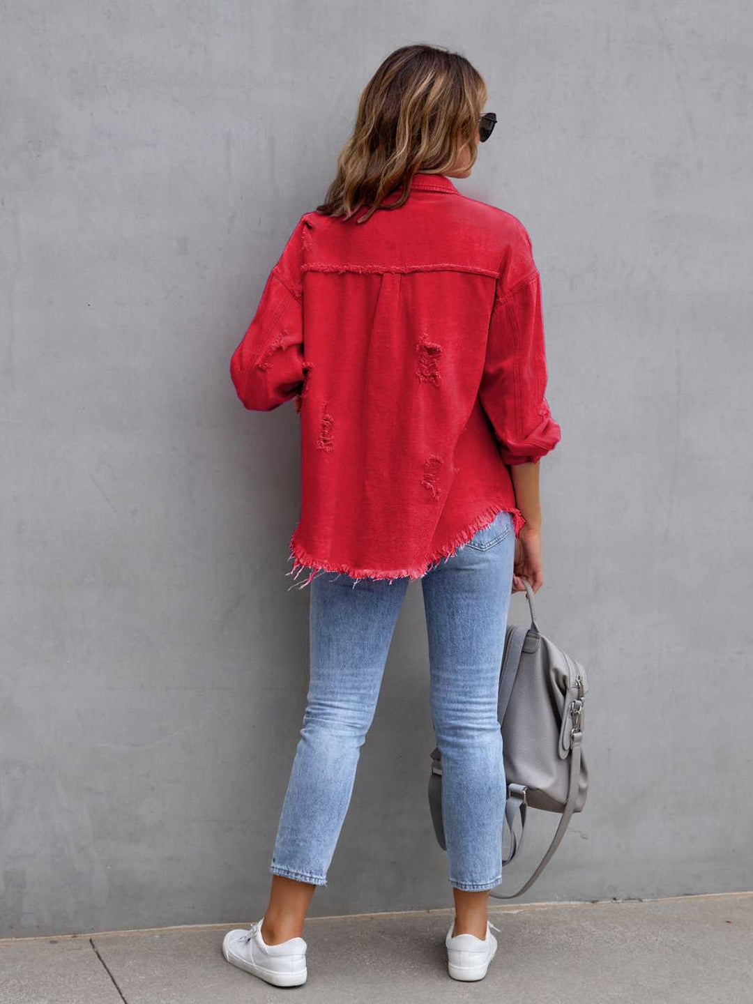 Distressed drop shoulder denim jacket with fringe hem