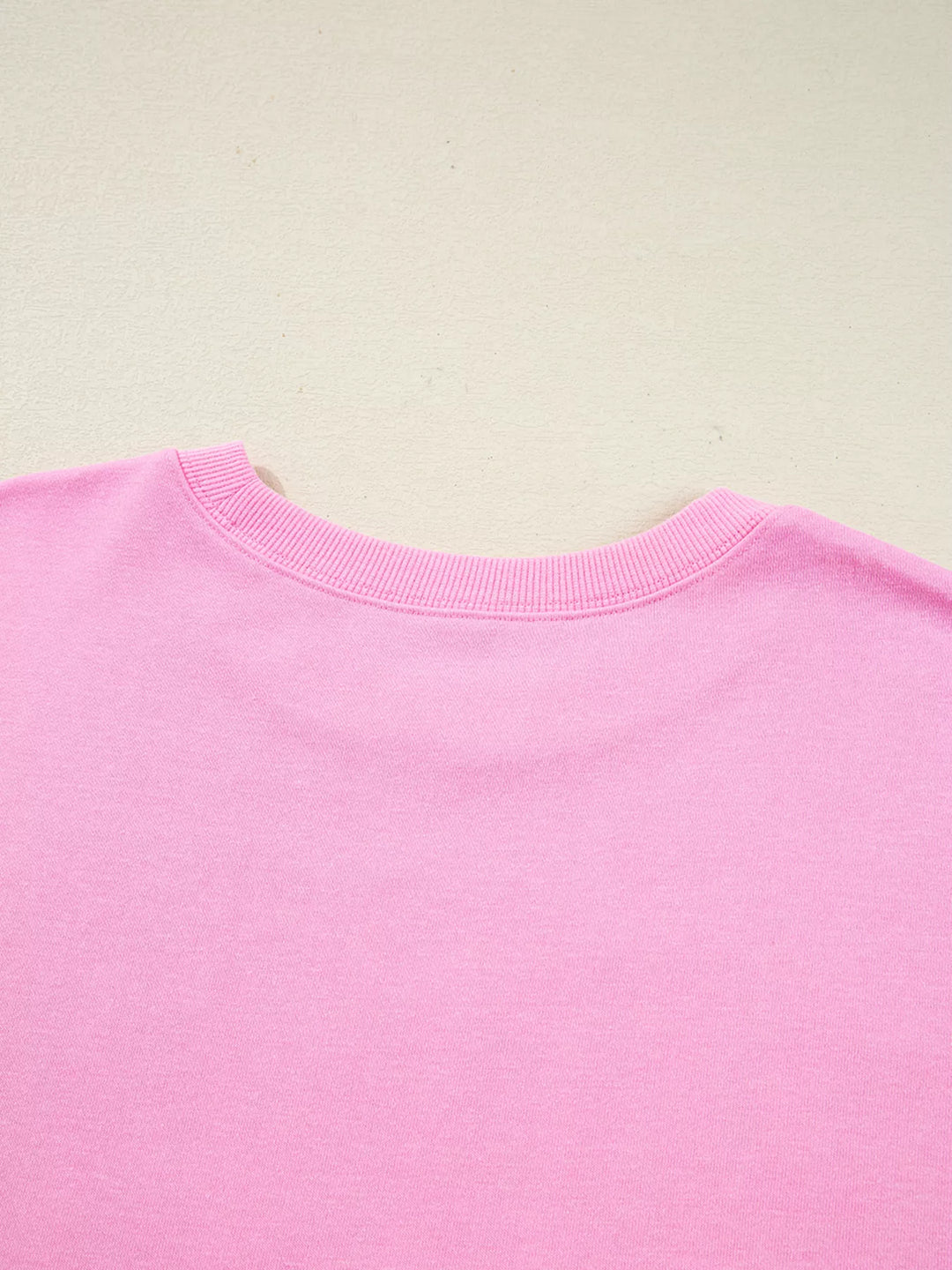 Oversized XOXO graphic sweatshirt with exposed seams and bows