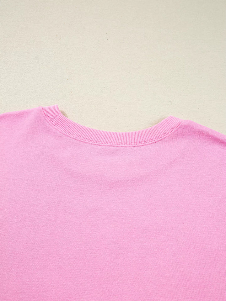 Oversized XOXO graphic sweatshirt with exposed seams and bows