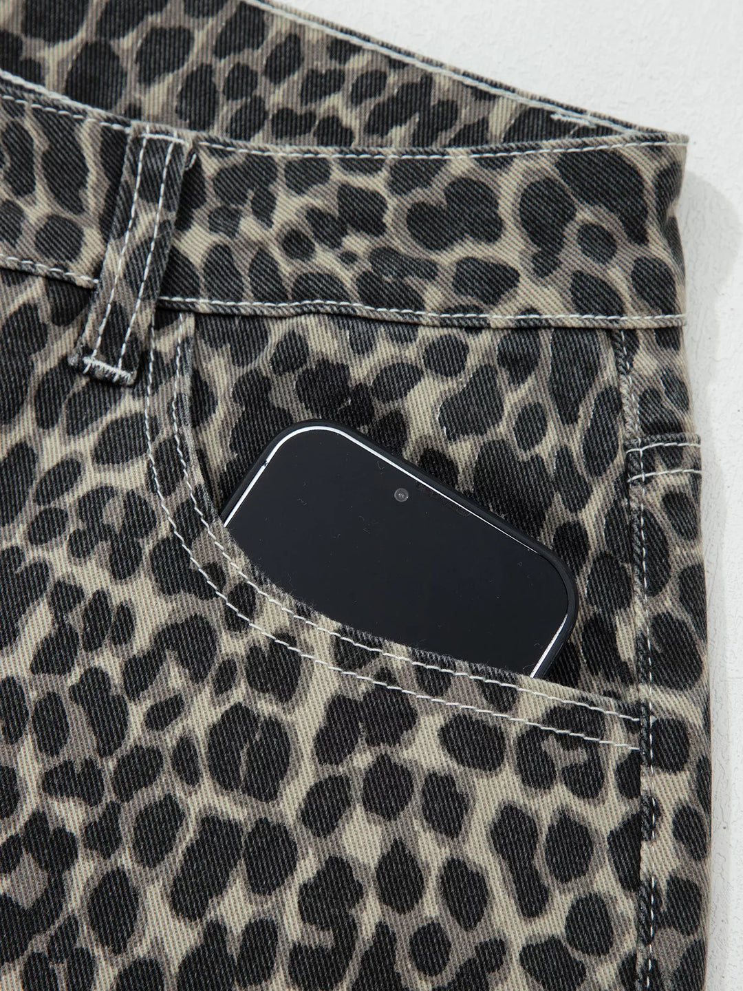 Leopard print high-rise barrel-leg jeans with pockets