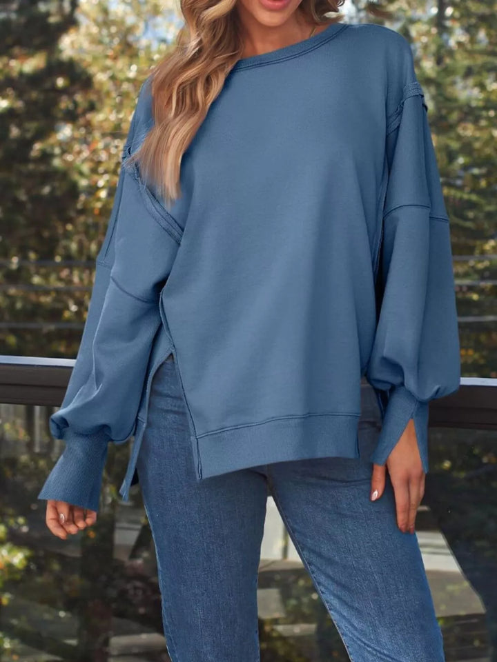Oversized side-slit sweatshirt with exposed seams