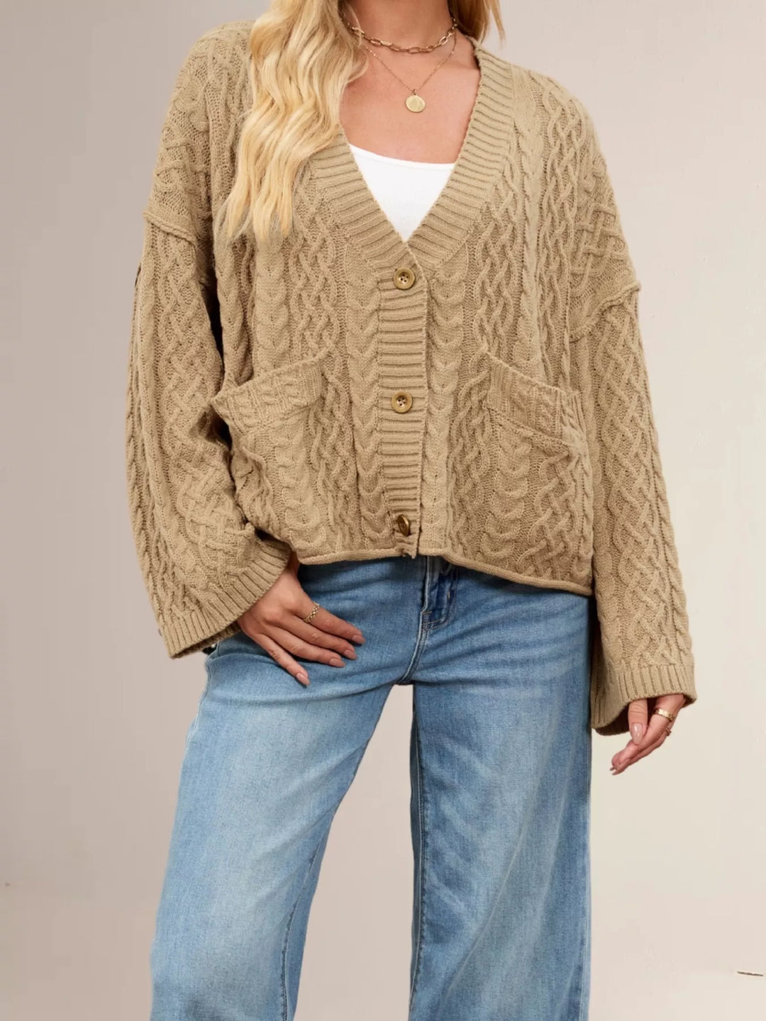 Cable knit button-front cardigan with patch pockets