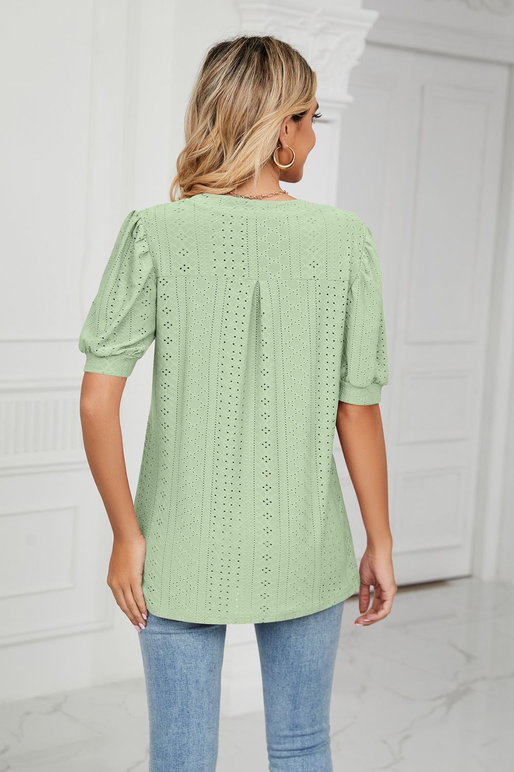 Eyelet puff sleeve top with notched V-neck