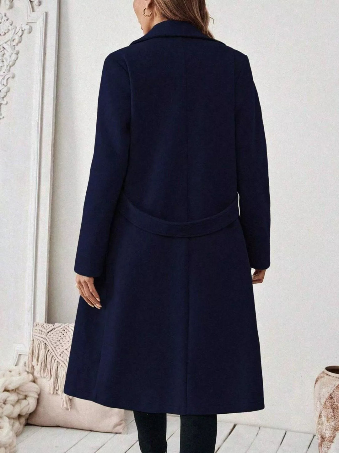 Longline notch lapel coat with single-button waist tab