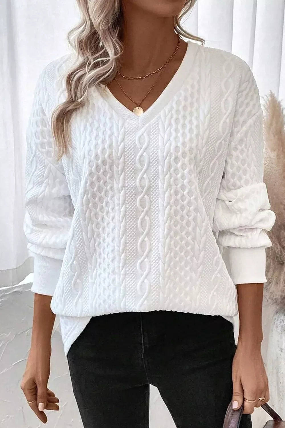 Cable-knit drop-shoulder V-neck pullover sweater
