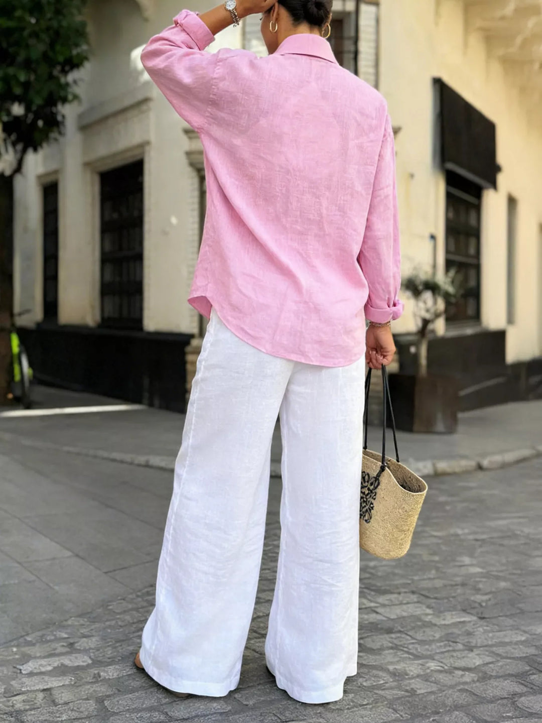 Relaxed cotton button-up shirt with curved hem
