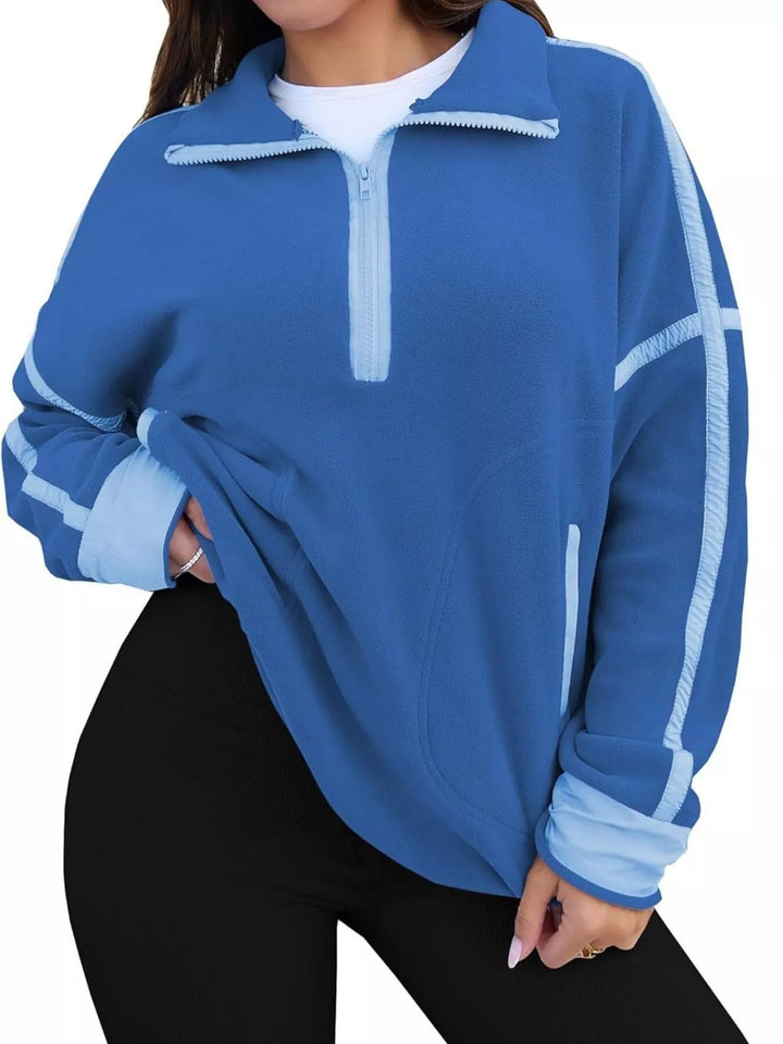 Half-zip fleece pullover with contrast trim and zip pockets