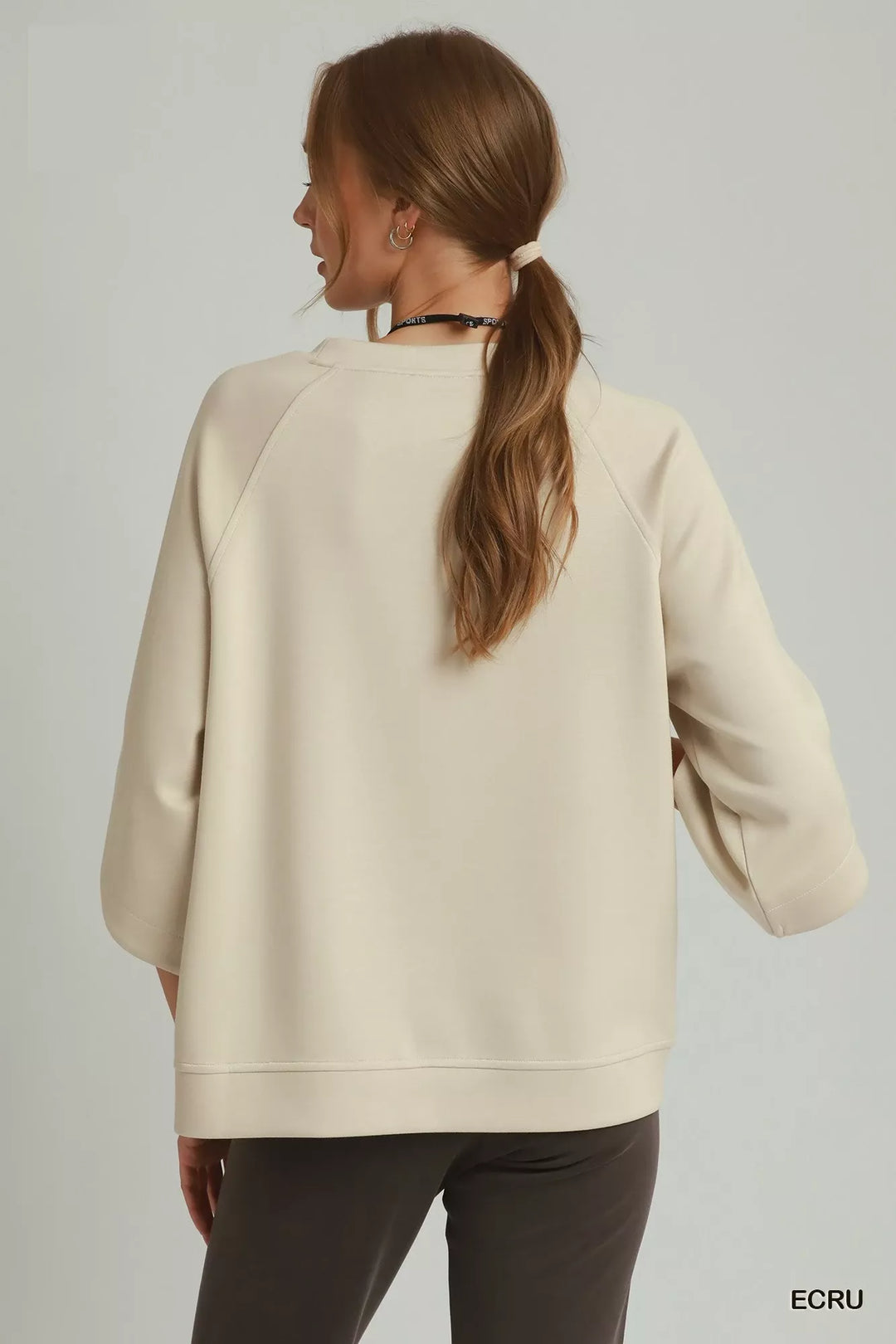 Relaxed raglan pullover with wide sleeves and ribbed hem