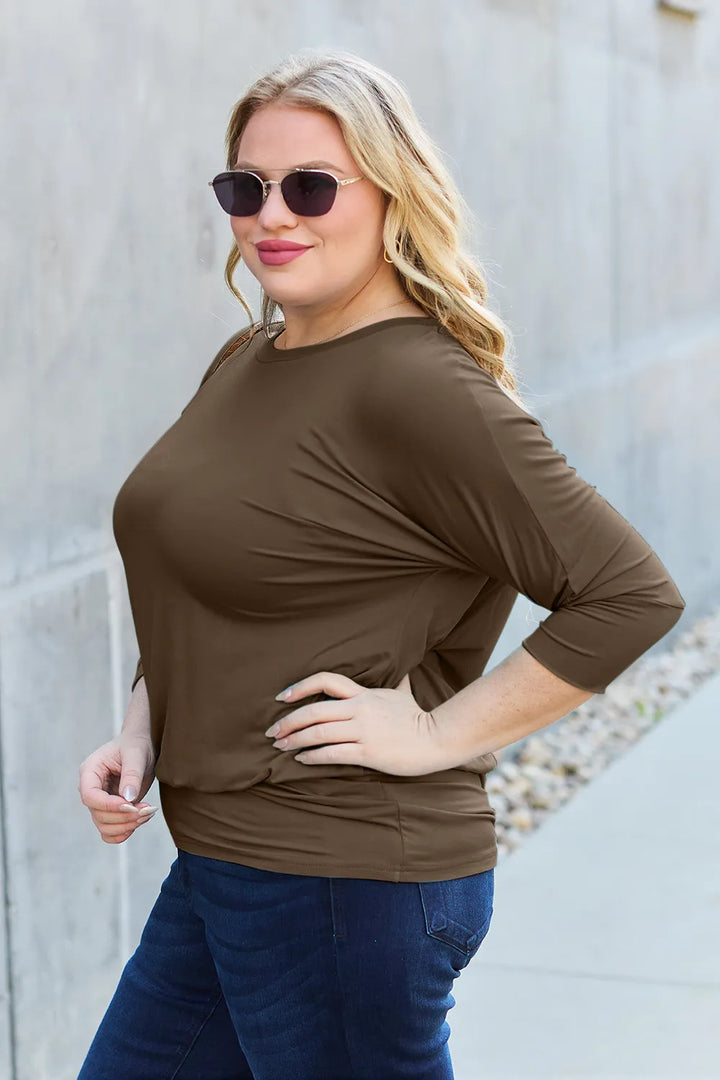 Batwing sleeve top with banded blouson hem