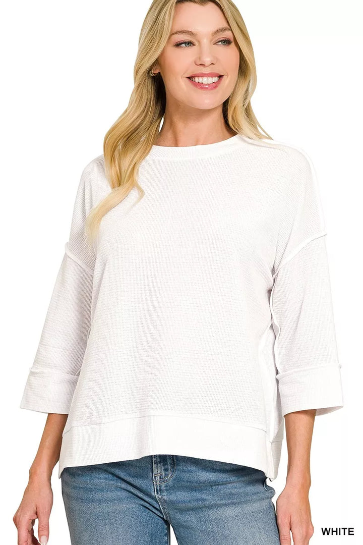 Double knit crew neck pullover top with 3/4 sleeves and side slits
