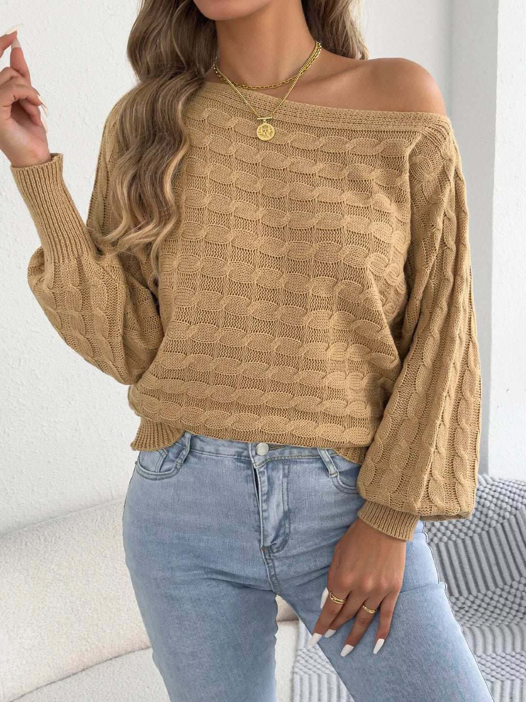 Cable knit boat neck sweater with dolman sleeves