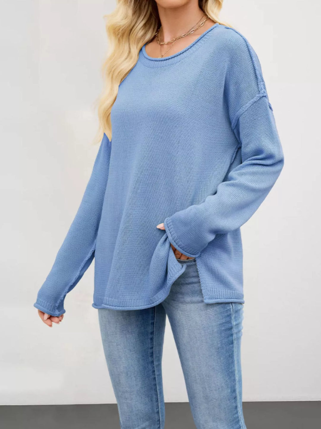 Exposed seam oversized crew neck sweater with raw hem