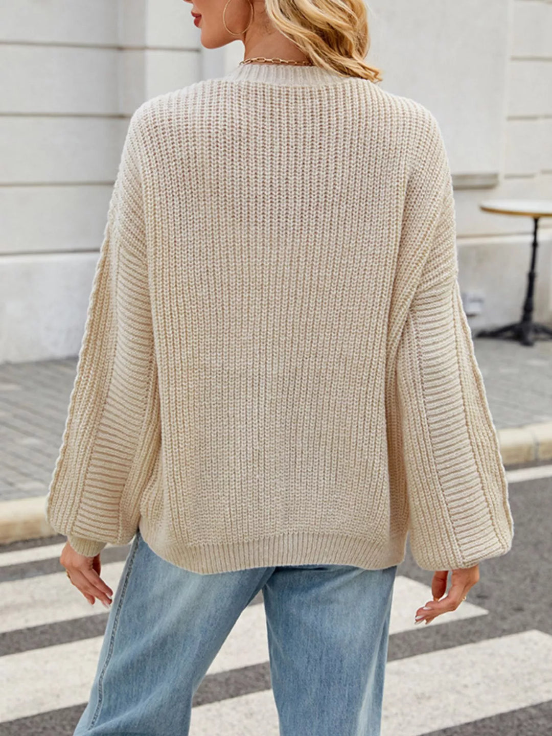 Cable knit button-front cardigan with drop shoulder sleeves