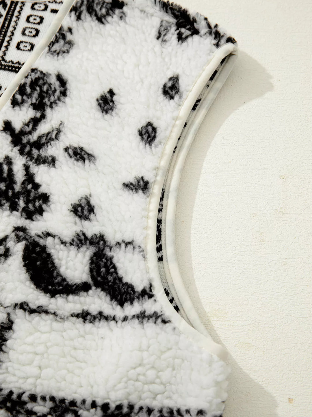 Open-front sherpa vest with paisley print and patch pockets
