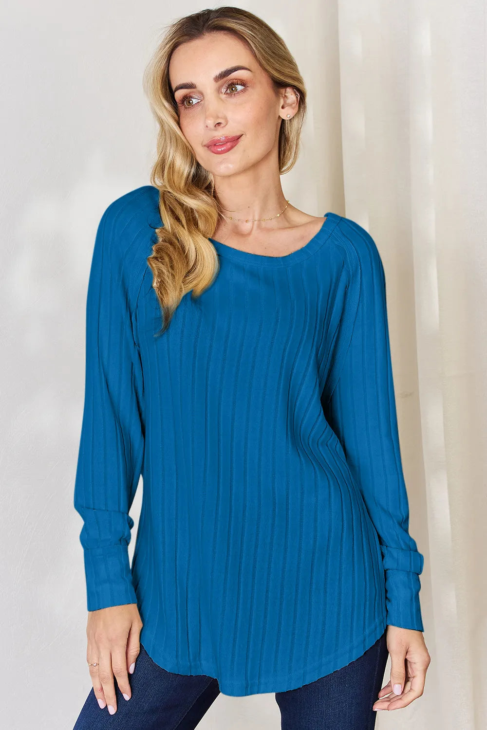 Ribbed knit round neck long sleeve top with side slits
