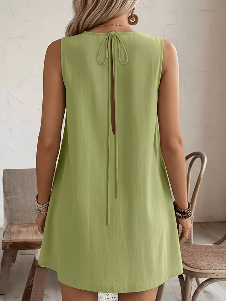 Ruffle-trim sleeveless mini dress with side pockets