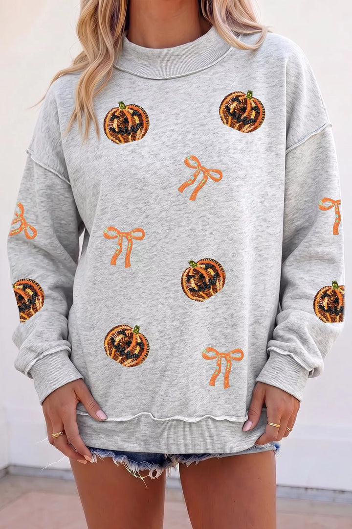 Sequin pumpkin and bow exposed seam Halloween sweatshirt
