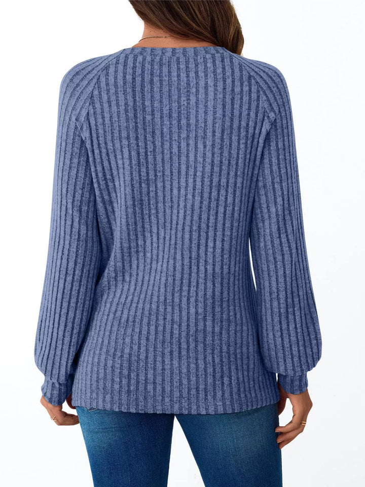 Ribbed knit long sleeve top with decorative shoulder buttons