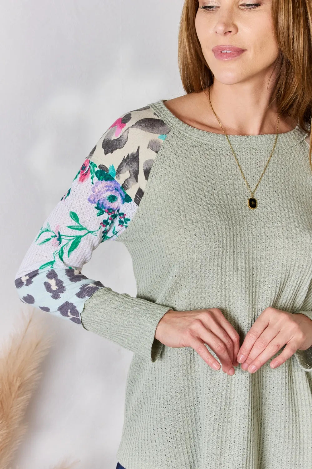 Waffle knit top with floral and leopard print sleeves