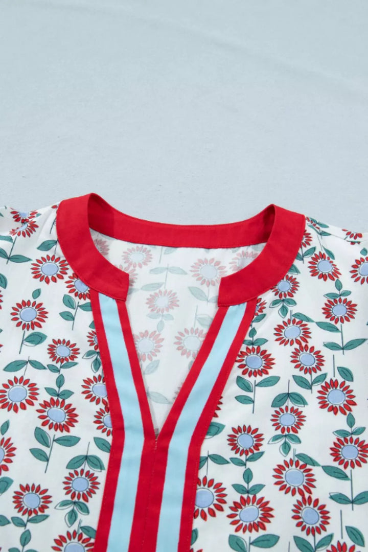 Floral babydoll blouse with ruffle cap sleeves and striped V-neck