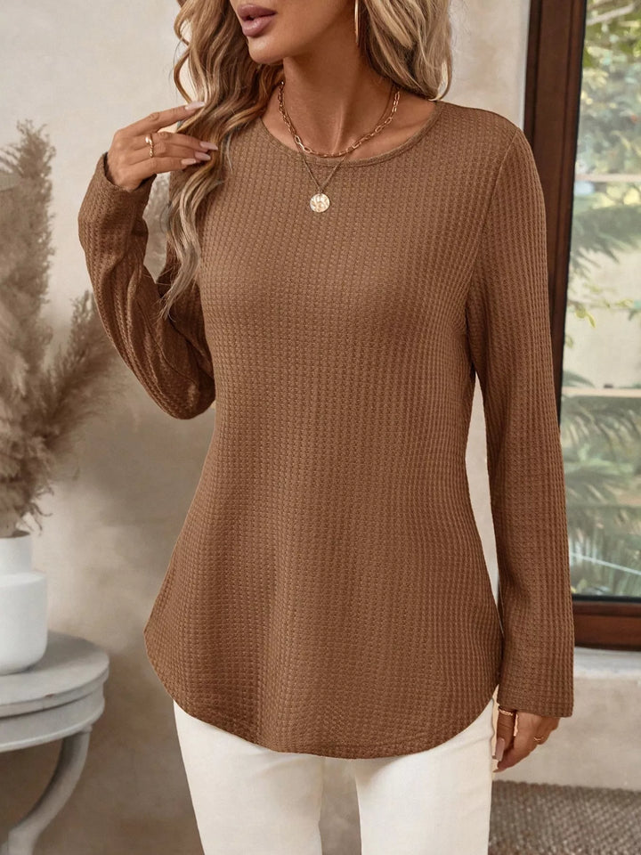 Waffle knit crew neck long sleeve top with curved hem