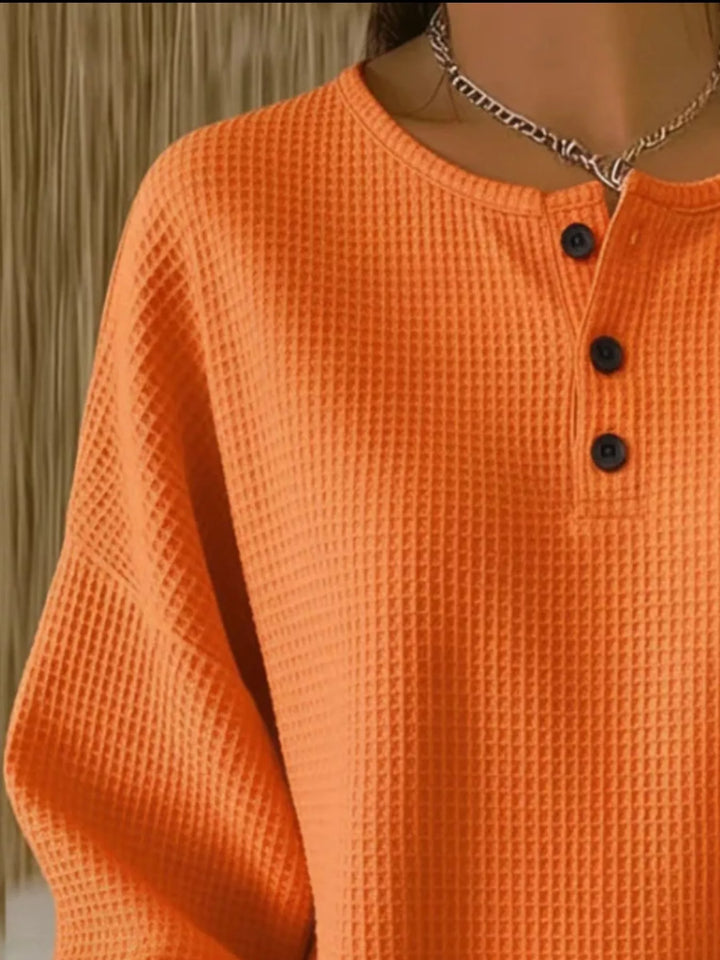 Waffle knit henley top with button placket and long sleeves
