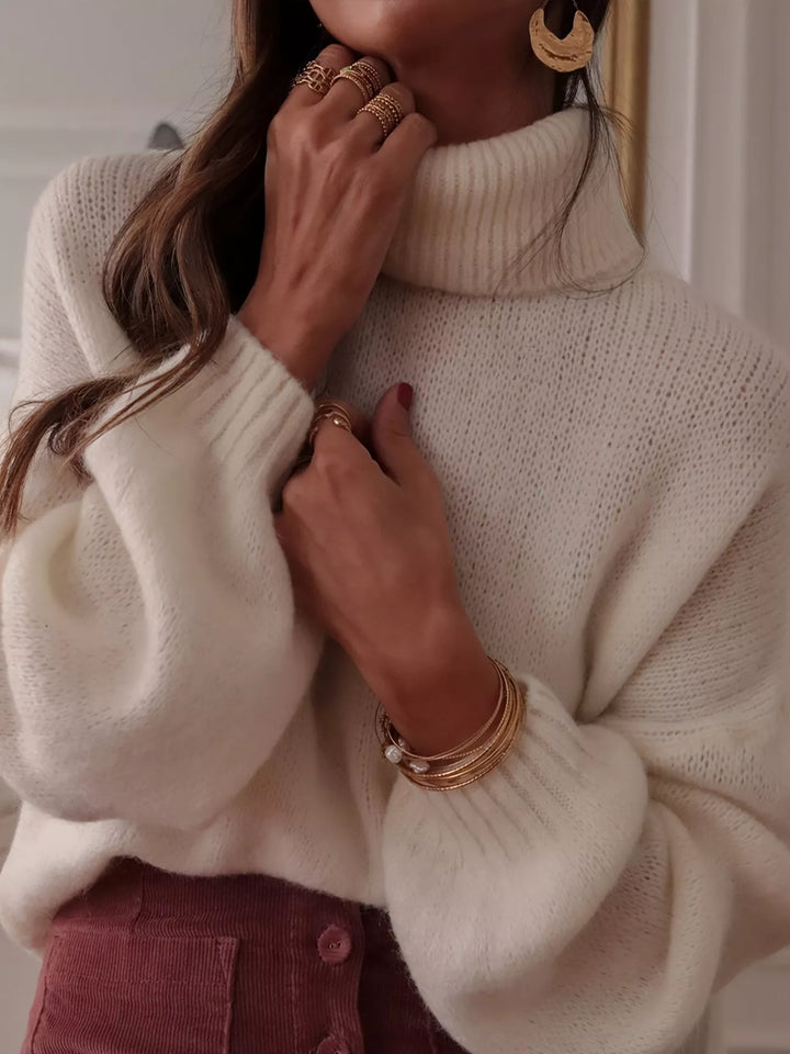 Oversized turtleneck sweater with dropped shoulders and ribbed cuffs