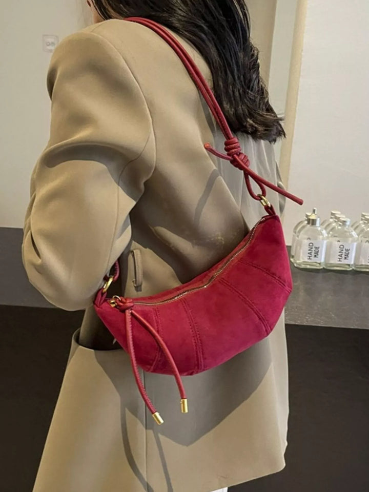 Crescent suede-look crossbody bag with knotted strap
