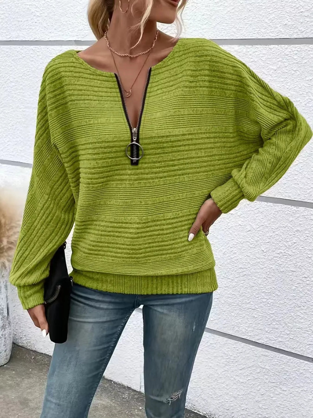 Ribbed knit quarter-zip batwing sweater with O-ring pull