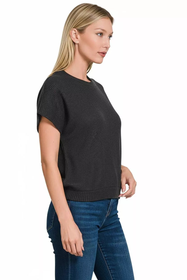 Waffle knit short sleeve sweater with banded hem