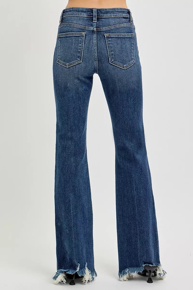 Mid-rise flare jeans with raw frayed hem in stretch denim