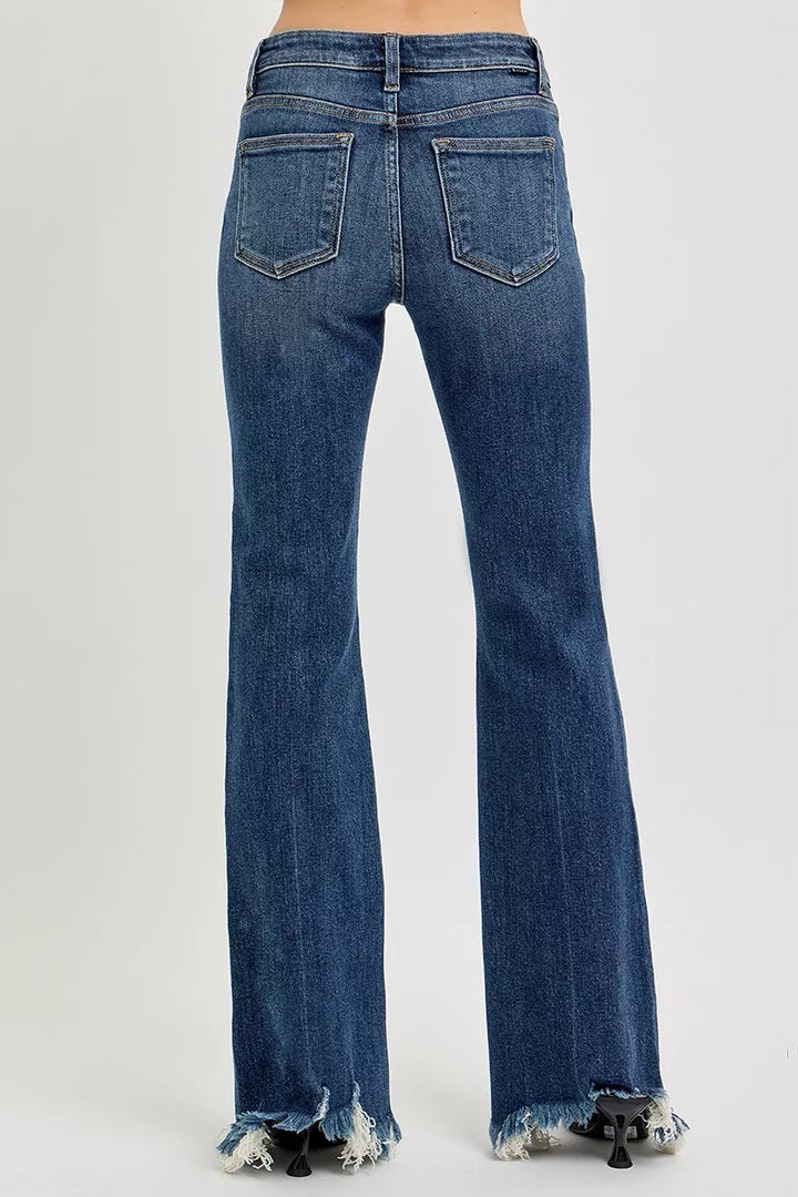 Mid-rise flare jeans with raw frayed hem in stretch denim
