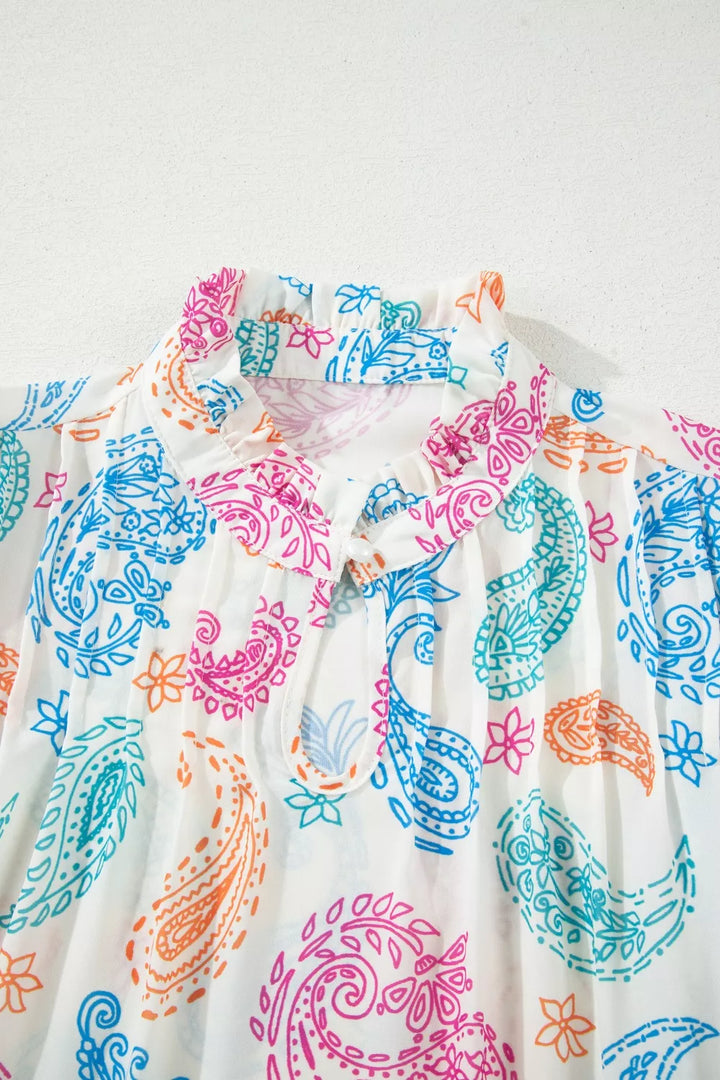 Paisley print keyhole blouse with ruffle neck and puff sleeves