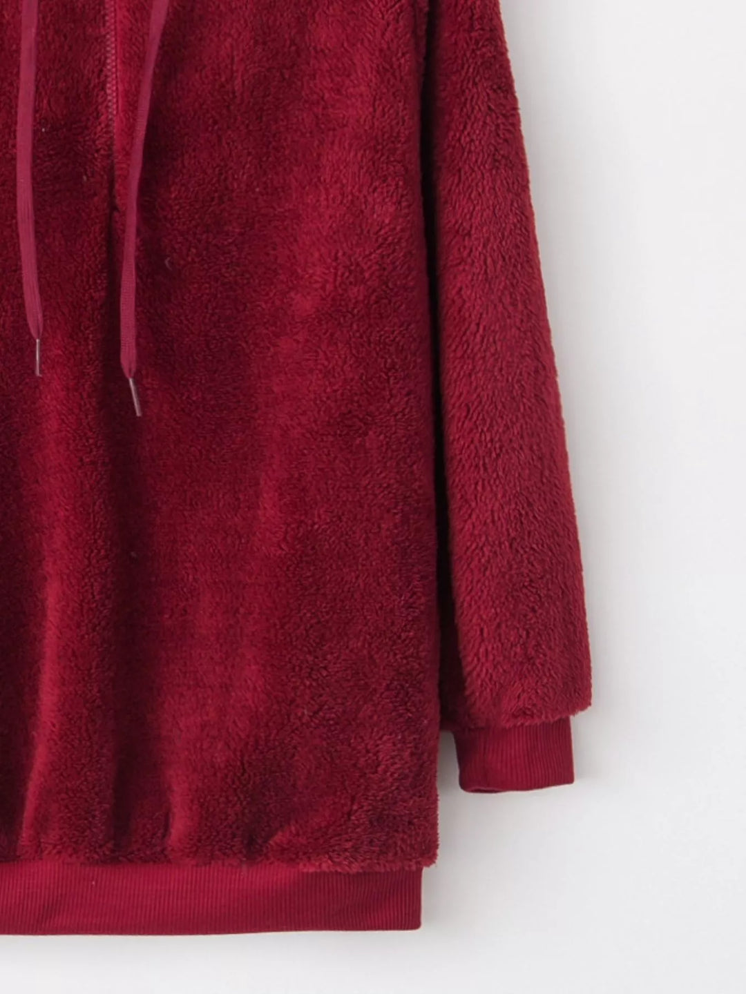 Plush half-zip fleece hoodie with drawstring hood and pockets