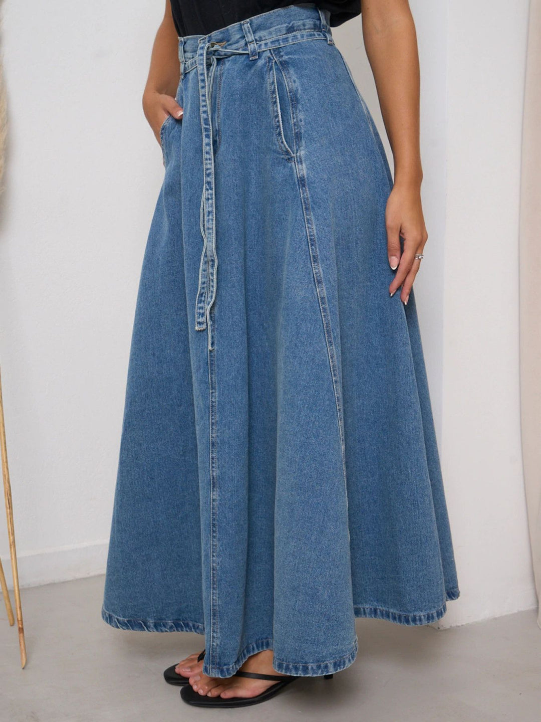 High-waisted belted A-line maxi denim skirt