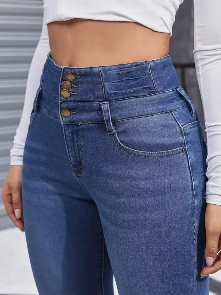 High-rise fleece-lined skinny jeans with stacked button waist