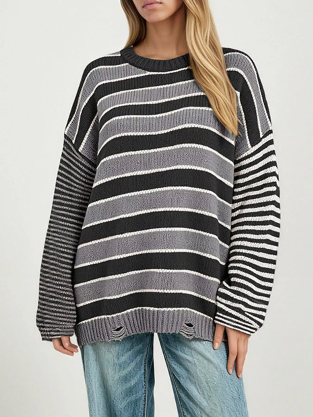 Black Distressed striped oversized knit sweater with raw hem