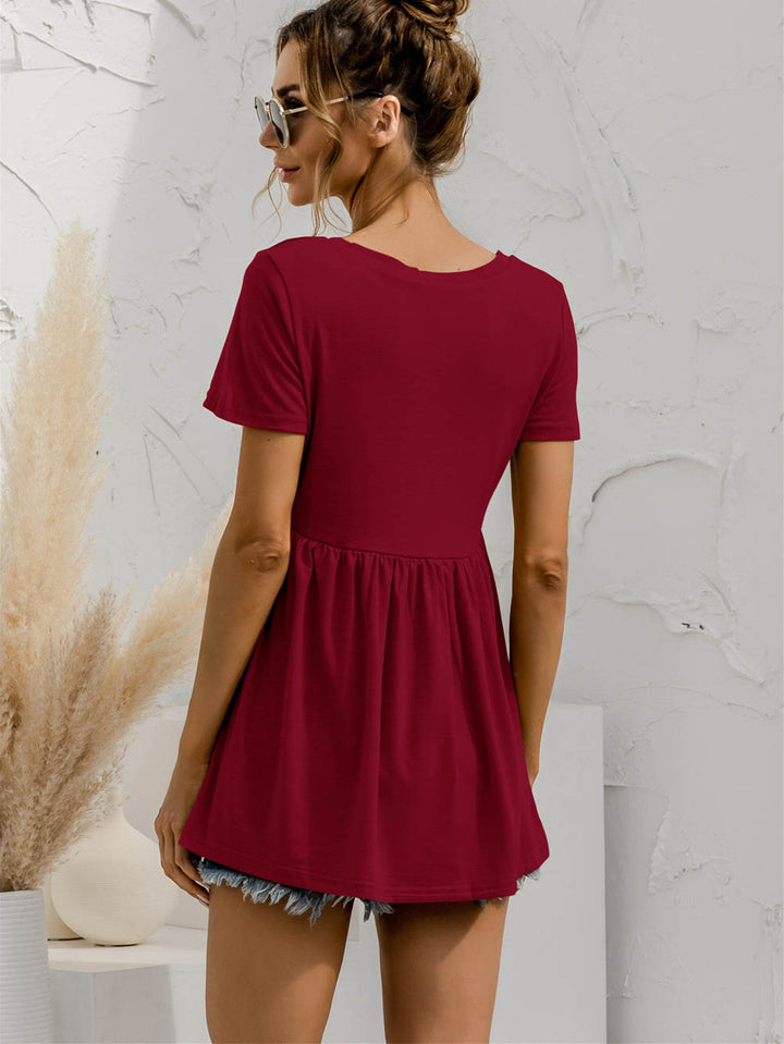 V-neck babydoll top with short sleeves and empire waist
