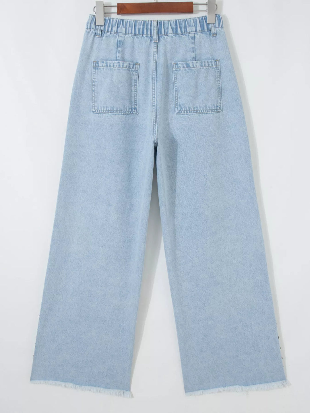 Studded wide leg jeans with side slits and frayed hem