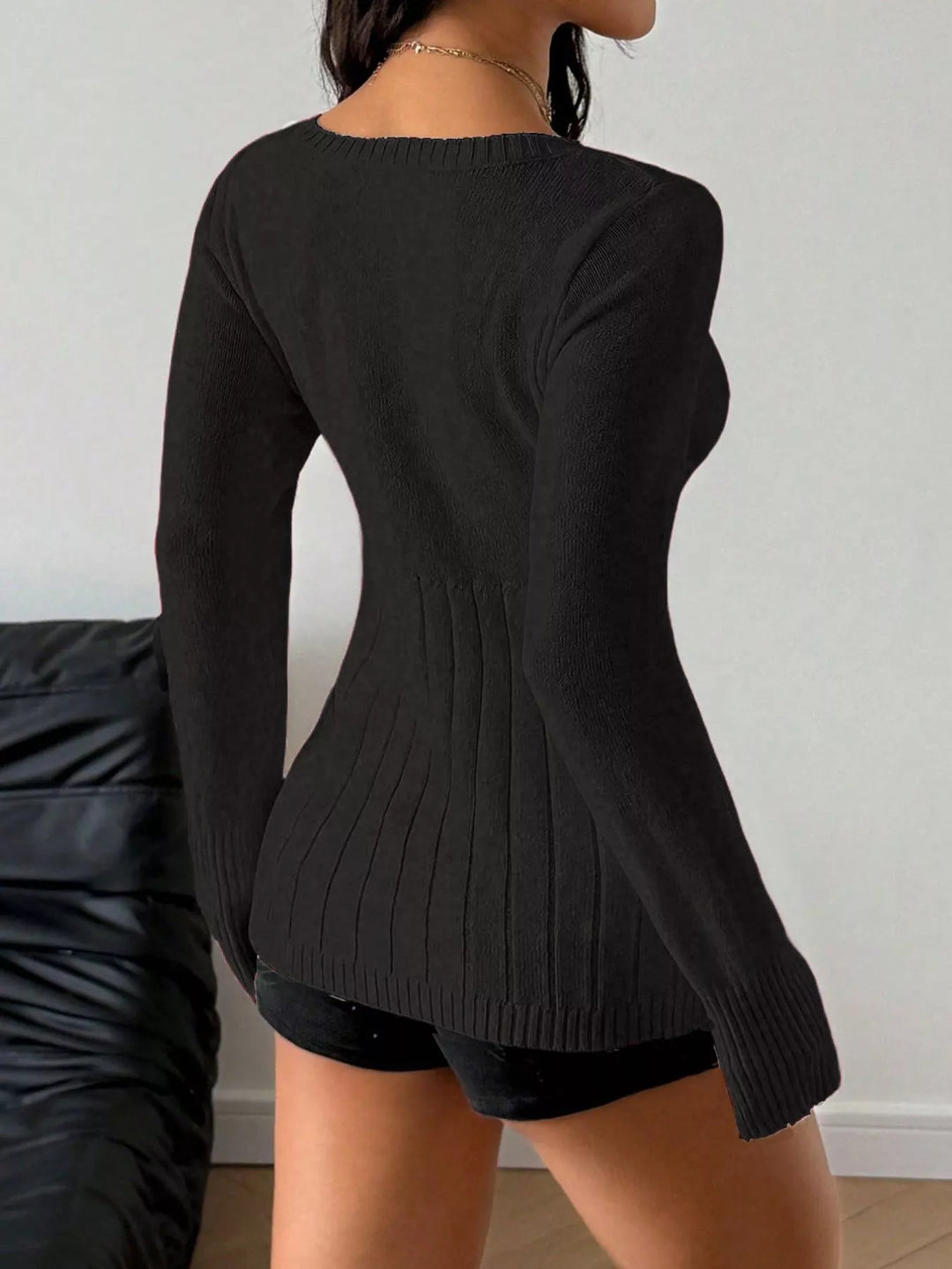 Fitted cable knit sweater with button-front placket