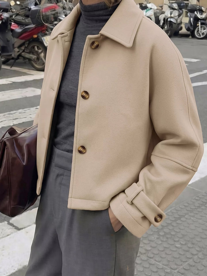 Cropped collared button-up jacket with cuff tabs
