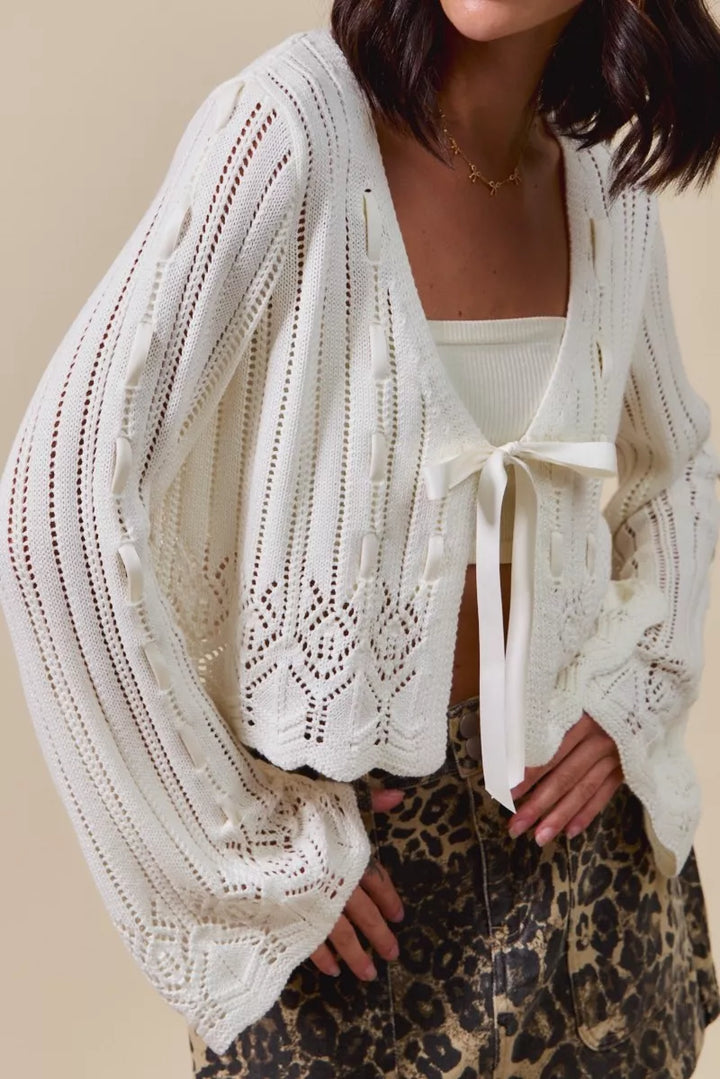 Cropped open-knit cardigan with bell sleeves and bow tie