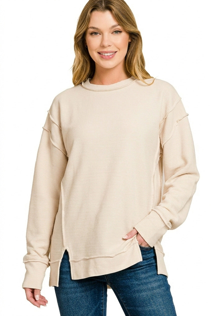 Ribbed exposed-seam pullover sweatshirt with side slits