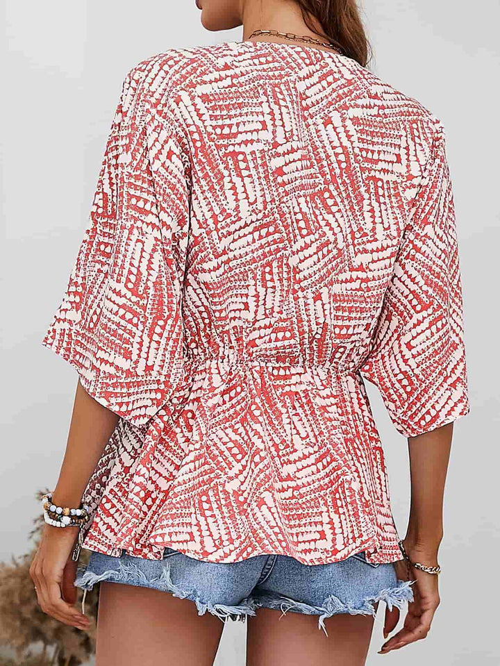 Abstract print V-neck dolman sleeve blouse