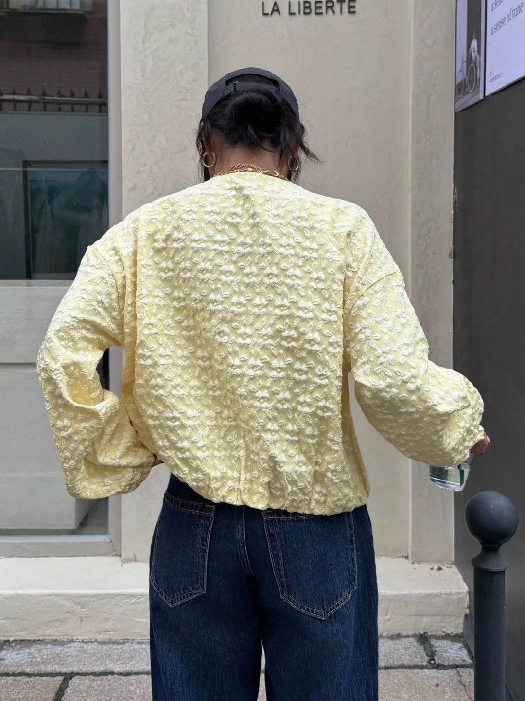 Floral textured zip-up collarless cropped jacket