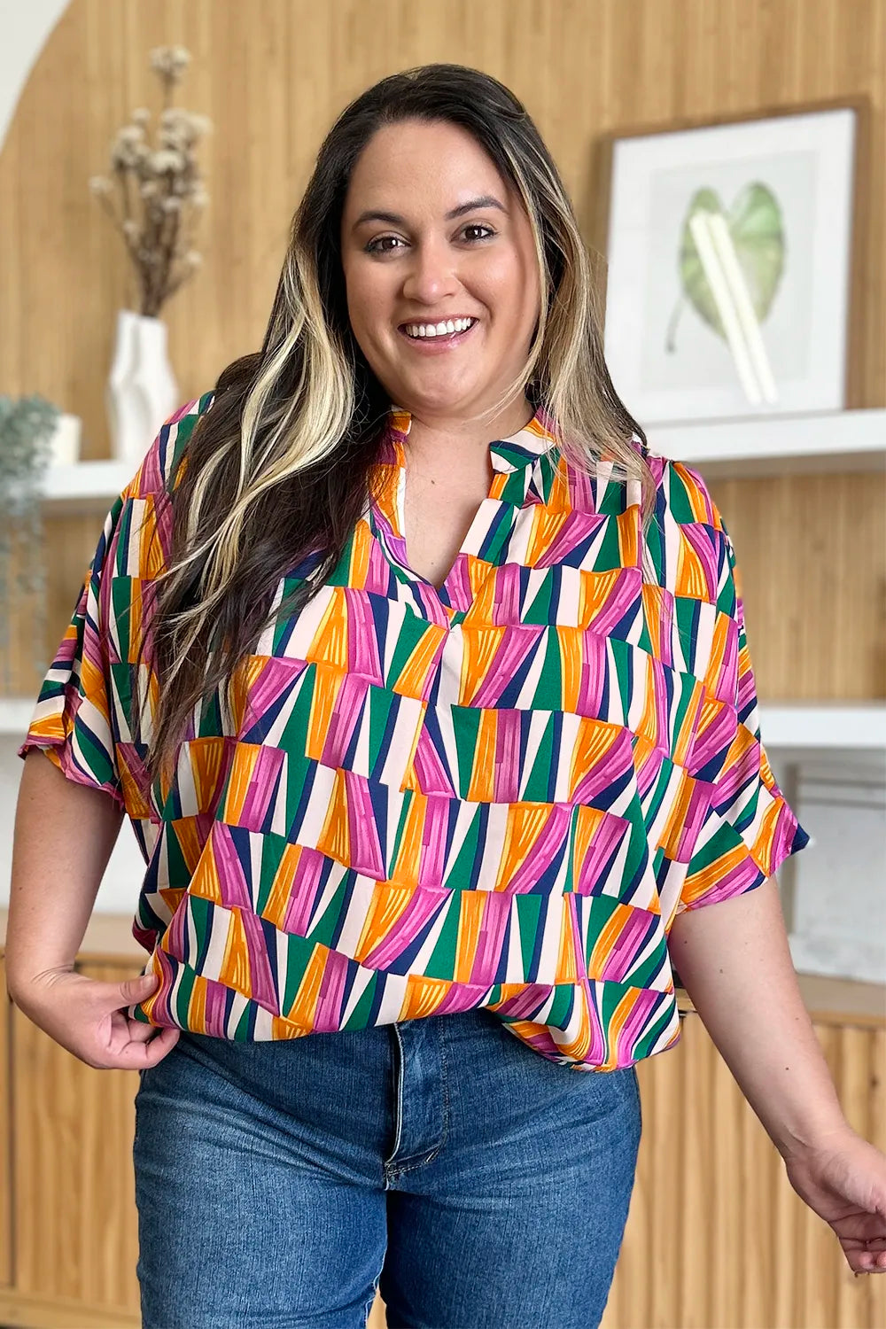 Geometric print notched neck dolman sleeve top