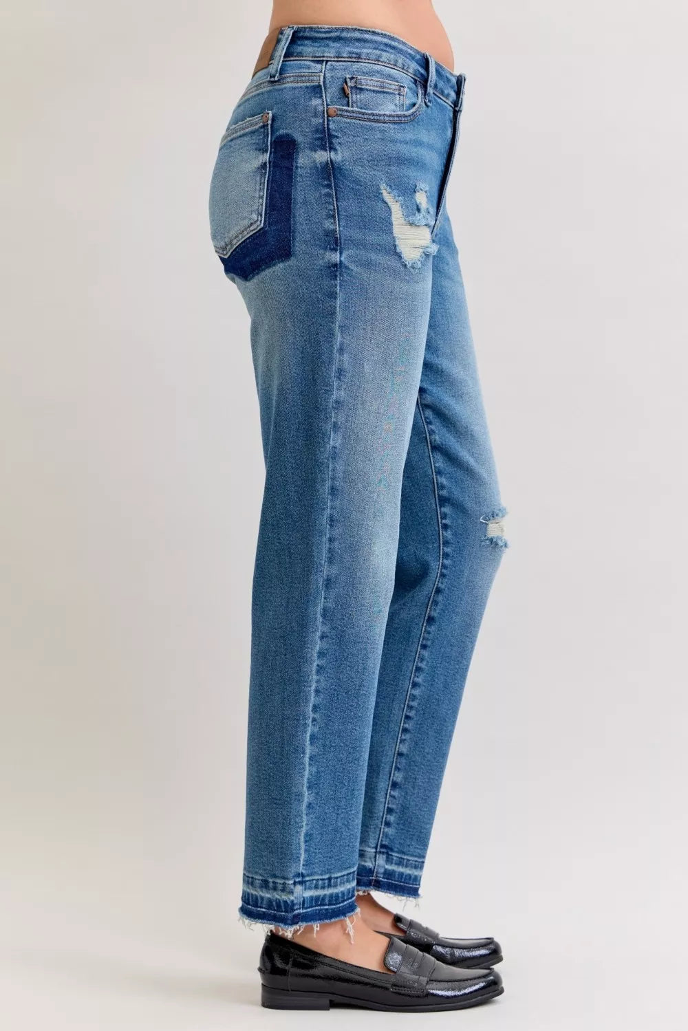 Distressed mid-rise boyfriend jeans with released raw hem